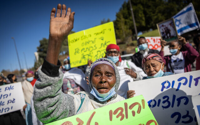 Members of Israel's Ethiopian community protest outside the Interior Ministry in Jerusalem, January 9, 2022. (Yonatan Sindel/Flash90) Members of Israel's Ethiopian community protest outside the Interior Ministry in Jerusalem, January 9, 2022. (Yonatan Sindel/Flash90)