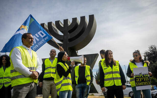 Israelis protest against the rising cost of living, outside the Knesset in Jerusalem, February 2, 2022. (Yonatan Sindel/Flash90) Israelis protest against the rising cost of living, outside the Knesset in Jerusalem, February 2, 2022. (Yonatan Sindel/Flash90)