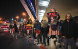 Nationalist activists protest the closure of a probe into the death of Ahuvia Sandak, at the entrance of Jerusalem, on February 3, 2022. (Noam Revkin/Flash90)