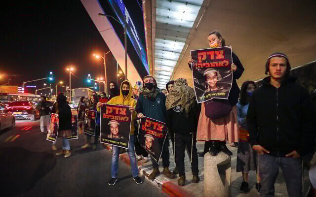 Nationalist activists protest the closure of a probe into the death of Ahuvia Sandak, at the entrance of Jerusalem, on February 3, 2022. (Noam Revkin/Flash90) Nationalist activists protest the closure of a probe into the death of Ahuvia Sandak, at the entrance of Jerusalem, on February 3, 2022. (Noam Revkin/Flash90)