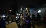 Israel Police officers disperse protesters and residents in the East Jerusalem neighborhood of Sheikh Jarrah, February 17, 2022. (Arie Leib Abrams/Flash90)