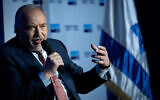 Finance Minister Avigdor Liberman speaks at a conference of the Israeli newspaper "Makor Rishon" at the International Convention Center in Jerusalem, February 21, 2022. (Yonatan Sindel/Flash90)