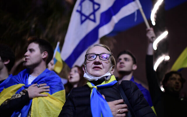 Demonstrators carry placards and flags during a protest against the Russian invasion of Ukraine, outside the Russian Embassy in Tel Aviv, on February 24, 2022. (Tomer Neuberg/Flash90) Demonstrators carry placards and flags during a protest against the Russian invasion of Ukraine, outside the Russian Embassy in Tel Aviv, on February 24, 2022. (Tomer Neuberg/Flash90)
