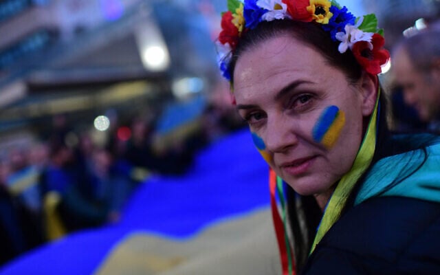 Demonstrators carry placards and flags during a protest march against the Russian invasion of Ukraine, in Tel Aviv, on February 26, 2022 (Tomer Neuberg/Flash90) Demonstrators carry placards and flags during a protest march against the Russian invasion of Ukraine, in Tel Aviv, on February 26, 2022 (Tomer Neuberg/Flash90)