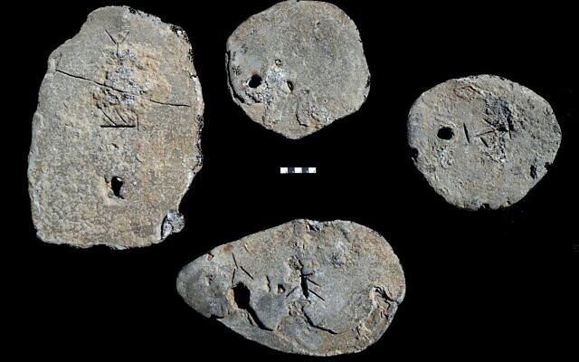 Four lead ingots dated to the 13th–early 12th century BCE that were found as part of a shipwreck cargo in the southern anchorage of Caesarea in Israel. (Ehud Galili/University of Haifa’s Institute for Maritime Studies) Four lead ingots dated to the 13th–early 12th century BCE that were found as part of a shipwreck cargo in the southern anchorage of Caesarea in Israel. (Ehud Galili/University of Haifa’s Institute for Maritime Studies)