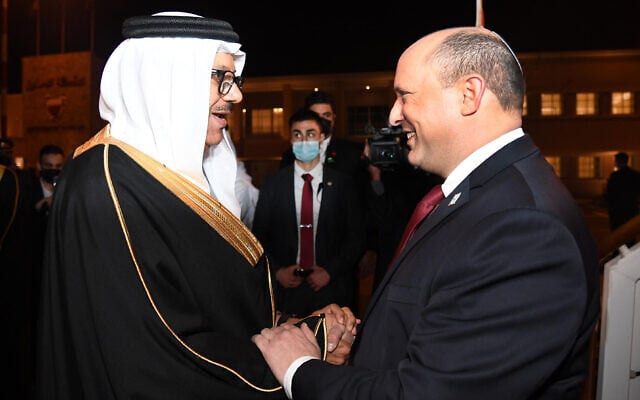 Prime Minister Naftali Bennett (R) is greeted by Bahrain's Foreign Minister Abdullatif bin Rashid Al-Zayani in the capital, Manama, on February 14, 2022. (Haim Zach/GPO) Prime Minister Naftali Bennett (R) is greeted by Bahrain's Foreign Minister Abdullatif bin Rashid Al-Zayani in the capital, Manama, on February 14, 2022. (Haim Zach/GPO)