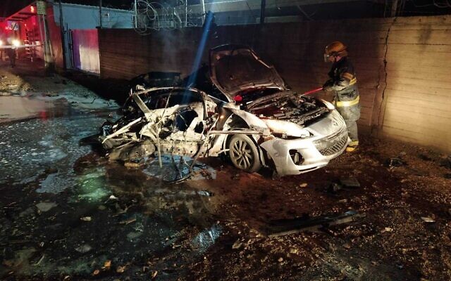 Firefighters douse a vehicle after an explosion that killed two people in central Israel on February 12, 2022 (Fire and Rescue Services) Firefighters douse a vehicle after an explosion that killed two people in central Israel on February 12, 2022 (Fire and Rescue Services)