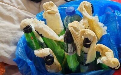 This undated handout photo released by the Israel Police on February 14, 2022, shows Molotov cocktails found in the home of a suspect in the firebombing of a Jewish house in East Jerusalem's Sheikh Jarrah neighborhood. (Israel Police)