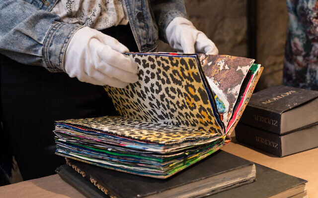 Perusing an art book at the In Print Art Book Fair, opening February 16, 2022 at Jerusalem's Hansen House (Courtesy In Print)