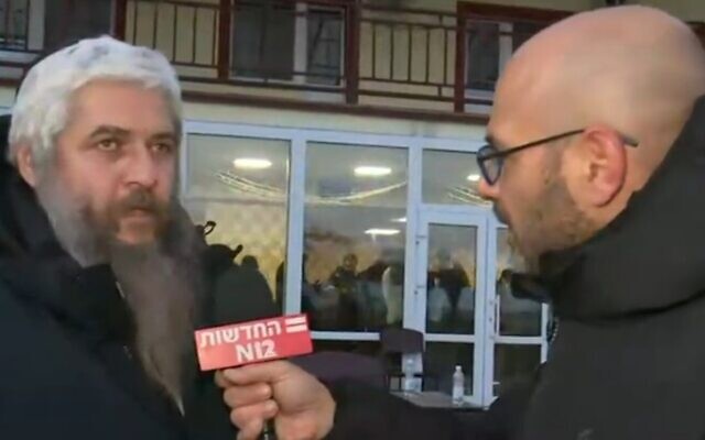 Rabbi Moshe Azman speaks to Israel's Channel 12 outside a Kyiv area Jewish community center, on February 28, 2022. (Screenshot) Rabbi Moshe Azman speaks to Israel's Channel 12 outside a Kyiv area Jewish community center, on February 28, 2022. (Screenshot)
