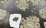 Coins that were among antiquities seized from a Palestinian suspected of stealing and trading in antiquities and who was arrested in Kafr Qallil, February 8, 2022 (IDF Civil Administration)
