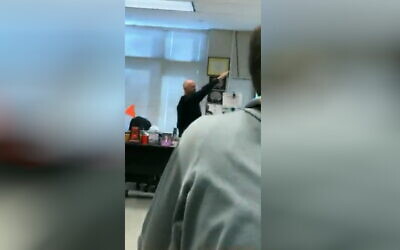 A teacher at Mountain Brook High School is seen giving a Nazi salute, in a video published on February 8, 2022. (Screenshot: Twitter)