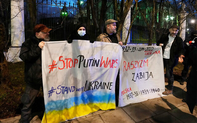 Pro-Ukraine protesters outside the Russian Embassy in Warsaw, Poland, February 23, 2022. (AP Photo/Czarek Sokolowski) Pro-Ukraine protesters outside the Russian Embassy in Warsaw, Poland, February 23, 2022. (AP Photo/Czarek Sokolowski)
