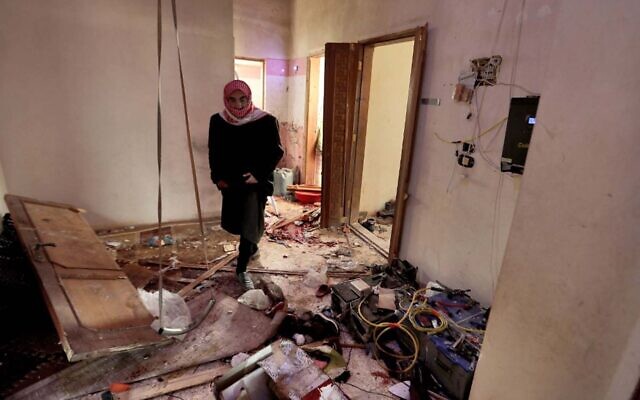 A man walks through the house where Islamic State leader Abu Ibrahim al-Hashimi al-Qurayshi was killed by US forces the night before, February 3, 2022. (Aaref Watad/AFP) A man walks through the house where Islamic State leader Abu Ibrahim al-Hashimi al-Qurayshi was killed by US forces the night before, February 3, 2022. (Aaref Watad/AFP)