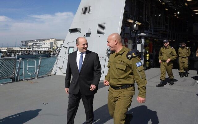 Prime Minsiter Naftali Bennett walks with the head of the Israeli Navy David Salama during a visit to the navy's Haifa Base, on February 8, 2022. (Amos Ben-Gershon/Government Press Office) Prime Minsiter Naftali Bennett walks with the head of the Israeli Navy David Salama during a visit to the navy's Haifa Base, on February 8, 2022. (Amos Ben-Gershon/Government Press Office)