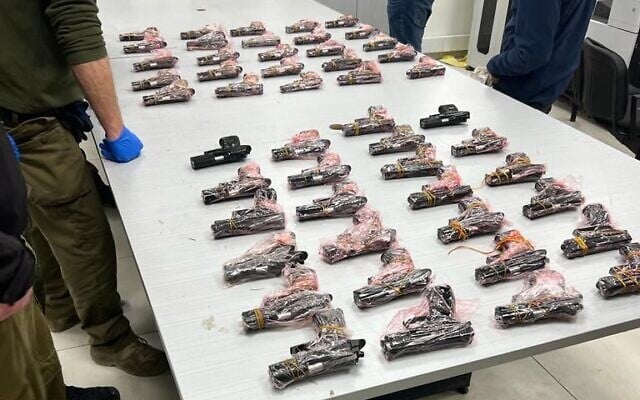Weapons seized by Israeli security forces during a gun-smuggling attempt along the border with Jordan on February 17, 2022. (Israel Defense Forces) Weapons seized by Israeli security forces during a gun-smuggling attempt along the border with Jordan on February 17, 2022. (Israel Defense Forces)
