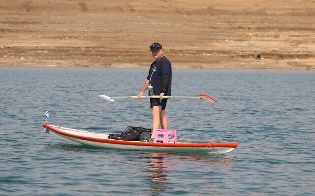 Benny 'Pinky' Hod sails his hasake board from where the Jordan River enters the Dead Sea to Kalia Beach, February 18, 2022. (Malka Nihom) Benny 'Pinky' Hod sails his hasake board from where the Jordan River enters the Dead Sea to Kalia Beach, February 18, 2022. (Malka Nihom)