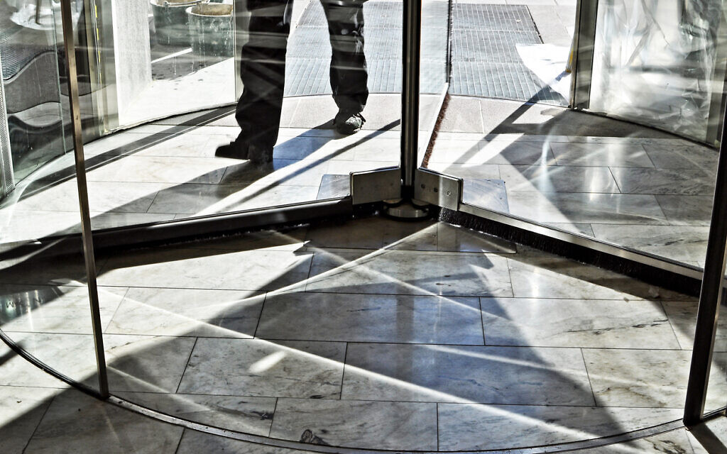 A person walking through a revolving door. Illustrative.(AnkiHoglund via iStock by Getty Images) A person walking through a revolving door. Illustrative.(AnkiHoglund via iStock by Getty Images)