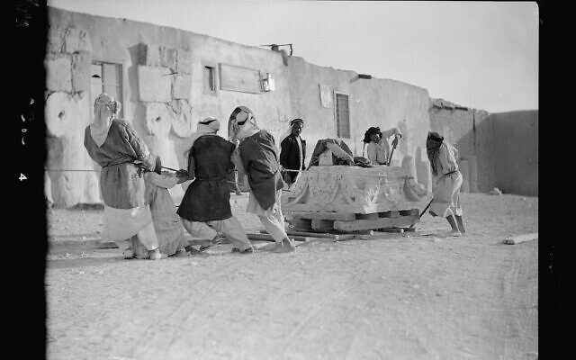 Workers lug a capital, the top of a column, in Palmyra, Syria, sometime between 1920 and 1933. How artifacts like this made their way into museums is part of the research of Mirjam Brusius, one of nine winners of the 2022 Dan David prize. (Matson Collection/American Colony Jerusalem, via Library of Congress) Workers lug a capital, the top of a column, in Palmyra, Syria, sometime between 1920 and 1933. How artifacts like this made their way into museums is part of the research of Mirjam Brusius, one of nine winners of the 2022 Dan David prize. (Matson Collection/American Colony Jerusalem, via Library of Congress)
