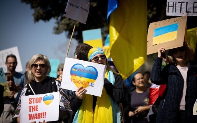 Demonstrators carry placards and flags during a protest march against the Russian invasion of Ukraine, outside the Israeli parliament, in Jerusalem, on February 28, 2022. (Yonatan Sindel/Flash90) Demonstrators carry placards and flags during a protest march against the Russian invasion of Ukraine, outside the Israeli parliament, in Jerusalem, on February 28, 2022. (Yonatan Sindel/Flash90)