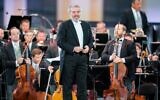 In this file photo taken on September 18, 2020, Russian conductor Valery Gergiev performs on stage with the Vienna Philharmonic Orchestra during the Summer Night Concert at Schoenbrunn Palace in Vienna, Austria, on September 18, 2020. The Munich Philharmonic on March 1, 2022, said it was parting ways with star Russian conductor Valery Gergiev 'with immediate effect' after he failed to respond to a request to denounce Moscow's invasion of Ukraine. (Georg Hochmuth/Pool/AFP)