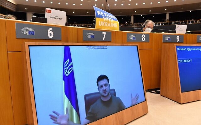 Ukrainian President Volodymyr Zelensky appears on a screen as he speaks in a video conference during a special plenary session of the European Parliament focused on the Russian invasion of Ukraine at the EU headquarters in Brussels, on March 01, 2022. (JOHN THYS / AFP) Ukrainian President Volodymyr Zelensky appears on a screen as he speaks in a video conference during a special plenary session of the European Parliament focused on the Russian invasion of Ukraine at the EU headquarters in Brussels, on March 01, 2022. (JOHN THYS / AFP)