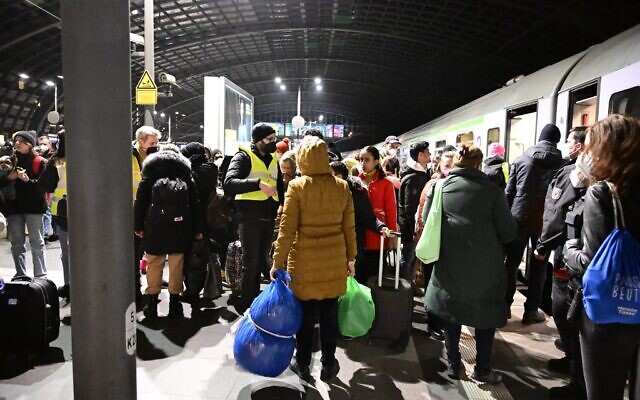 People arrive on a train from Ukraine's border at Berlin's main train station on March 2, 2022. (Tobias SCHWARZ / AFP)
