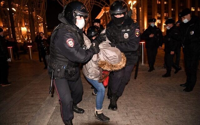 Police officers detain a person during a protest against Russia's invasion of Ukraine in central Moscow, on March 3, 2022. (AFP)