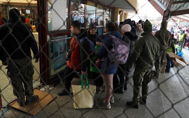Refugees from Ukraine are seen as they arrive at the railway station in Przemysl, eastern Poland, on March 4, 2022. (Janek Skarzynski/AFP) Refugees from Ukraine are seen as they arrive at the railway station in Przemysl, eastern Poland, on March 4, 2022. (Janek Skarzynski/AFP)