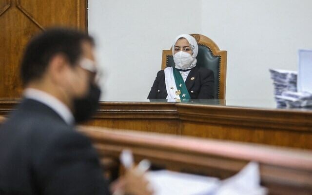 Egyptian female judge Radwa Helmi Ahmad sits on her first court hearing at the State Council in the capital Cairo, on March 5, 2022. (Samer ABDALLAH / AFP) Egyptian female judge Radwa Helmi Ahmad sits on her first court hearing at the State Council in the capital Cairo, on March 5, 2022. (Samer ABDALLAH / AFP)