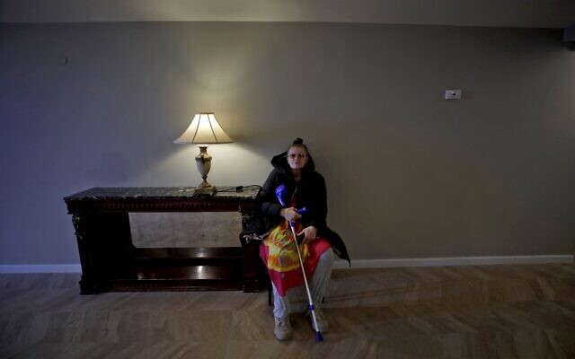 Nelja Gershman, a religious Jewish woman from Ukraine who escaped the Russian invasion of her home country, sits at a hotel room in the Israeli northern town of Nof Hagalil on March 6, 2022. - (JALAA MAREY / AFP)