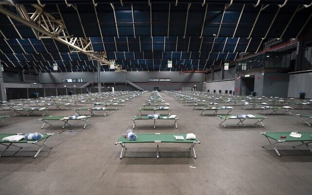 This photograph taken on March 9, 2022 shows beds in a shelter hub to welcome the first Ukrainian family in the Jaarbeurs Utrecht, The Netherlands. (Jeroen JUMELET / ANP / AFP) This photograph taken on March 9, 2022 shows beds in a shelter hub to welcome the first Ukrainian family in the Jaarbeurs Utrecht, The Netherlands. (Jeroen JUMELET / ANP / AFP)