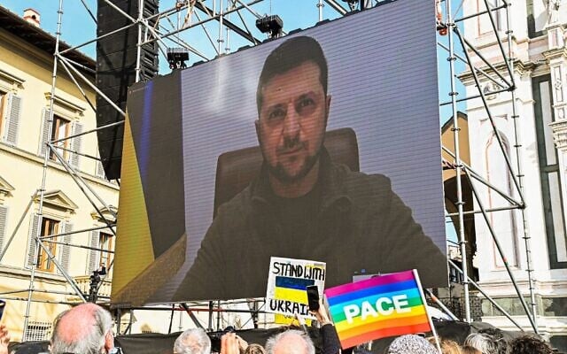 A giant screen shows Ukraine's President Volodymyr Zelensky speaking through a video link to people taking part in a peace rally for Ukraine on March 12, 2022 in Florence (Carlo BRESSAN / AFP) A giant screen shows Ukraine's President Volodymyr Zelensky speaking through a video link to people taking part in a peace rally for Ukraine on March 12, 2022 in Florence (Carlo BRESSAN / AFP)
