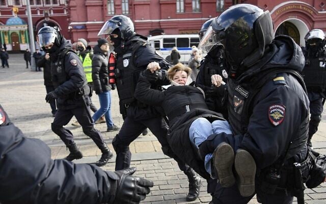 Police officers detain a woman during a protest against Russian military action in Ukraine, in Manezhnaya Square in central Moscow on March 13, 2022. (AFP) Police officers detain a woman during a protest against Russian military action in Ukraine, in Manezhnaya Square in central Moscow on March 13, 2022. (AFP)