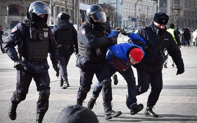 Russian police officers detain a man during a protest against Russia's invasion of Ukraine, in Manezhnaya square in central Moscow on March 13, 2022. (AFP) Russian police officers detain a man during a protest against Russia's invasion of Ukraine, in Manezhnaya square in central Moscow on March 13, 2022. (AFP)