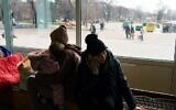 Evacuees from Mariupol wait at the Zaporizhzhya State Circus for transportation to other locations in the city of Zaporizhzhia on March 16, 2022. (Emre CAYLAK / AFP)