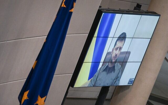 Ukrainian President Volodymyr Zelensky appears on a screen to address via videolink the German lower house of parliament, at the Bundestag in Berlin, March 17, 2022. (Tobias Schwarz/AFP) Ukrainian President Volodymyr Zelensky appears on a screen to address via videolink the German lower house of parliament, at the Bundestag in Berlin, March 17, 2022. (Tobias Schwarz/AFP)