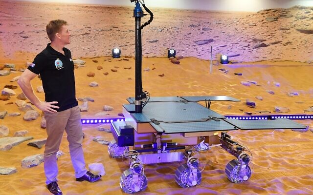 File: This photograph taken on February 07, 2019, shows British astronaut Tim Peake posing with a working prototype of the Rosalind Franklin ExoMars Rover following its naming ceremony at the Airbus Defence and Space facility in Stevenage, north of London. (Ben STANSALL / AFP) File: This photograph taken on February 07, 2019, shows British astronaut Tim Peake posing with a working prototype of the Rosalind Franklin ExoMars Rover following its naming ceremony at the Airbus Defence and Space facility in Stevenage, north of London. (Ben STANSALL / AFP)
