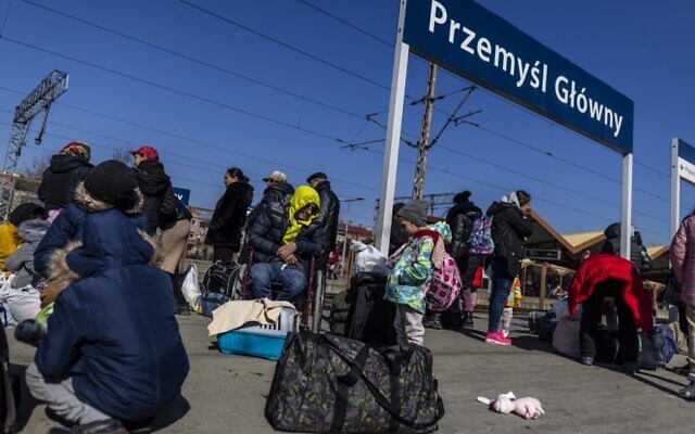 Refugees are seen as they wait for further transportation at the raiway station in Przemysl, Poland, on March 17, 2022. (Wojtek Radwanski/AFP) Refugees are seen as they wait for further transportation at the raiway station in Przemysl, Poland, on March 17, 2022. (Wojtek Radwanski/AFP)
