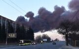 Smoke rises after an explosion in the western Ukrainian city of Lviv, on March 18, 2022 (Yuriy Dyachyshyn/AFP)