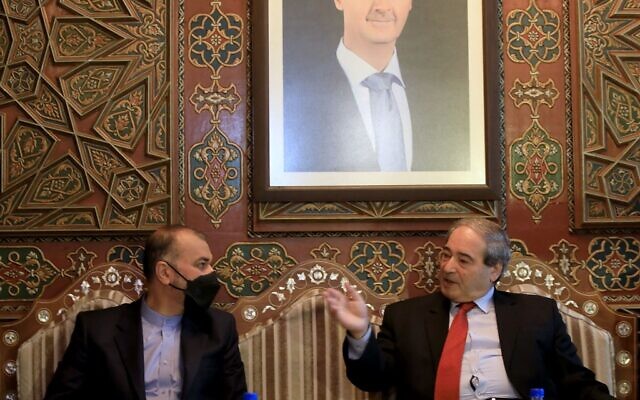 Iran's Foreign Minister Hossein Amir-Abdollahian (L) meets with his Syrian counterpart Faisal Mekdad in Damascus on March 23, 2022. (Louai Beshara / AFP)