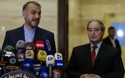 Iran's Foreign Minister Hossein Amir-Abdollahian (L) gives a press conference,  in the presence of his Syrian counterpart Faisal Mekdad, in the capital Damascus, Syria, on March 23, 2022. (LOUAI BESHARA / AFP)