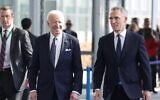 US President Joe Biden (L) and NATO Secretary General Jens Stoltenberg (R) arrive ahead of an extraordinary NATO summit at NATO Headquarters in Brussels on March 24, 2022. (Kenzo TRIBOUILLARD / AFP)