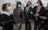 Illustrative: Germany's antisemitism commissioner Felix Klein, second from right, and Rabbi Gesa Ederberg, right, listen to the testimonies of Ukrainian Jewish youths at Berlin's Jewish International school in Berlin on March 24, 2022. (John MACDOUGALL / AFP)