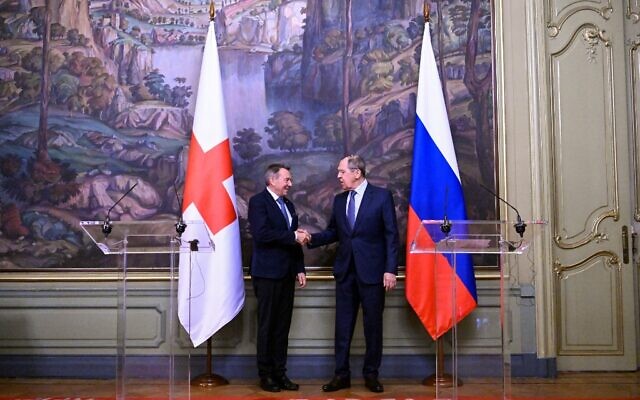 Russian Foreign Minister Sergei Lavrov and International Committee of the Red Cross (ICRC) President Peter Maurer shake hands at the end of a joint press conference following their talks in Moscow on March 24, 2022. (Kirill KUDRYAVTSEV / POOL / AFP) Russian Foreign Minister Sergei Lavrov and International Committee of the Red Cross (ICRC) President Peter Maurer shake hands at the end of a joint press conference following their talks in Moscow on March 24, 2022. (Kirill KUDRYAVTSEV / POOL / AFP)