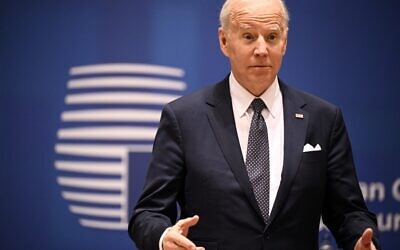 US President Joe Biden gestures ahead of a European Union (EU) summit at EU Headquarters in Brussels, March 24, 2022. (Photo by Brendan SMIALOWSKI / AFP)