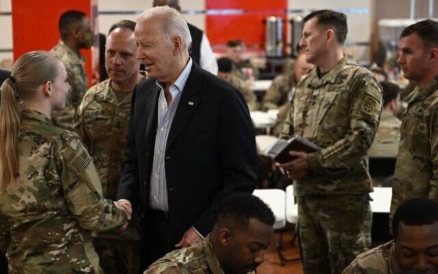 US President Joe Biden meets service members from the 82nd Airborne Division, who are contributing alongside Polish Allies to deterrence on the Alliance's Eastern Flank, in the city of Rzeszow in southeastern Poland, around 100 kilometers (62 miles) from the border with Ukraine, March 25, 2022. (Brendan SMIALOWSKI / AFP) US President Joe Biden meets service members from the 82nd Airborne Division, who are contributing alongside Polish Allies to deterrence on the Alliance's Eastern Flank, in the city of Rzeszow in southeastern Poland, around 100 kilometers (62 miles) from the border with Ukraine, March 25, 2022. (Brendan SMIALOWSKI / AFP)