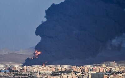 Smoke billows from an oil storage facility in Saudi Arabia's Red Sea coastal city of Jeddah after airstrikes by Iran-backed Houthi rebels, March 25, 2022. (Andrej Isakovic/AFP)