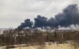 Smoke billows from the Pidzamche neighborhood after explosions were heard in the western Ukrainian city of Lviv, on March 26, 2022. (Marion Payet/AFP)