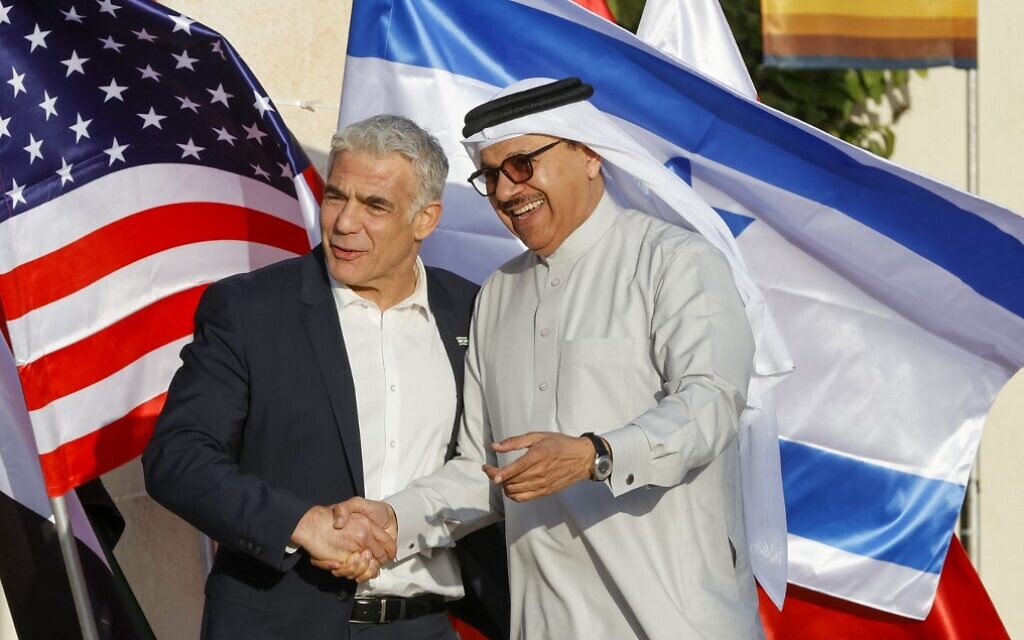 Foreign Minister Yair Lapid (L) welcomes his Bahraini counterpart Abdullatif bin Rashid al-Zayani at Sde Boker in southern Israel on March 27, 2022, ahead of the Negev Summit. (Jack Guez/AFP) Foreign Minister Yair Lapid (L) welcomes his Bahraini counterpart Abdullatif bin Rashid al-Zayani at Sde Boker in southern Israel on March 27, 2022, ahead of the Negev Summit. (Jack Guez/AFP)